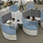 Curved high wall acoustic workstations with whiteboard